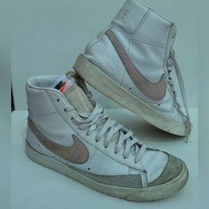 Pink and white Nike Blazers.